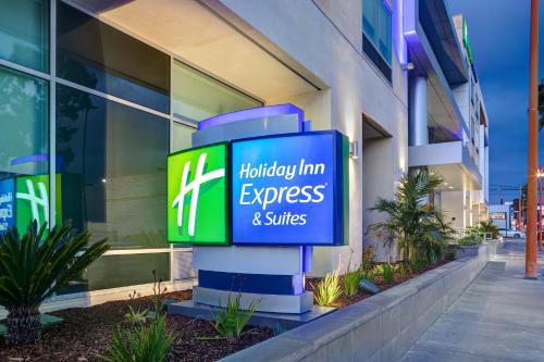 a sign for a hygiene inn express and suites at Holiday Inn Express & Suites - Glendale Downtown in Glendale