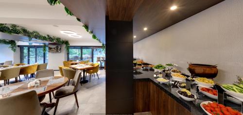 a dining room with a table with food on it at Leo Suites in Bursa