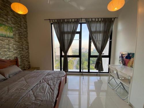 a bedroom with a bed and a large window at Islamic Santai Santai Homestay - Centrus Soho Cyberjaya in Cyberjaya