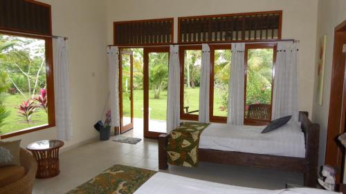 A bed or beds in a room at Rumah Kita Villa/hotel