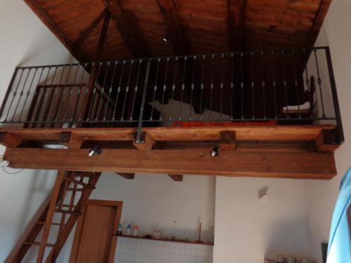 a room with a wooden ceiling with a pipe organ at Il Vigneto in Norcia