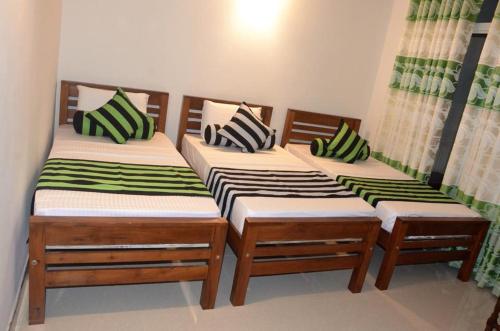 Katil atau katil-katil dalam bilik di Sarala Residence