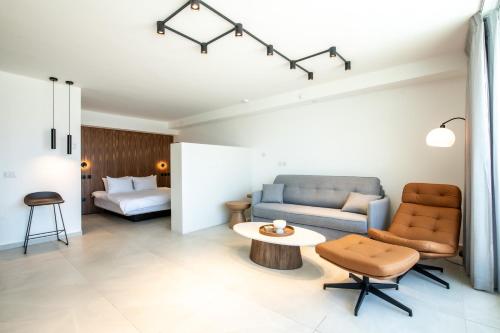 a living room with a couch and a table at Beach Side- Ceasar Luxury Amazing Pool Eilat in Eilat
