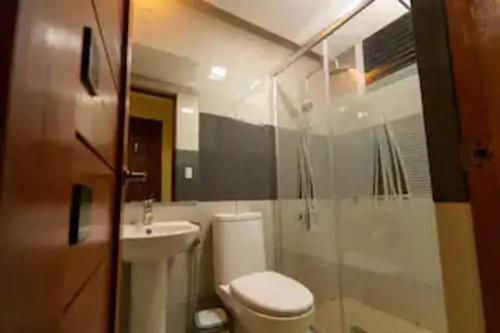 a bathroom with a toilet and a sink at CIDNYLAND FARM AND RESORT TANAY in Tanay