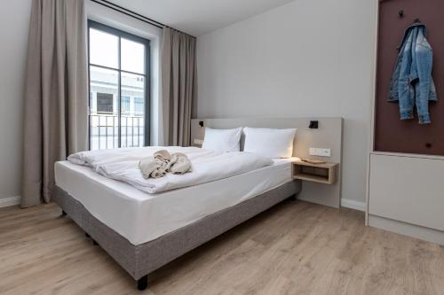 Ένα ή περισσότερα κρεβάτια σε δωμάτιο στο Gustav Appartements