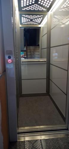 a door with a mirror in a room at B&B casa Liliana in Turin