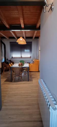 a living room with a table and a couch at Los Arroyos in San Martín de la Vega del Alberche