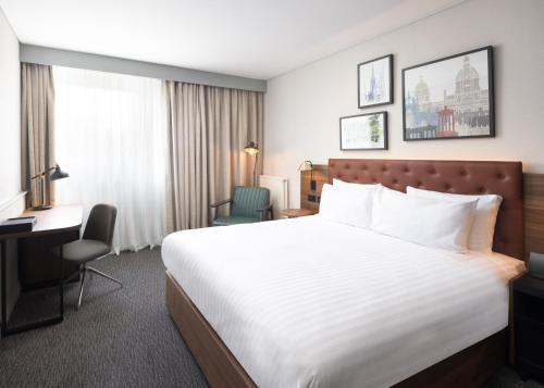 a hotel room with a bed and a desk at Four Points by Sheraton Edinburgh in Edinburgh
