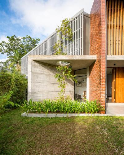 a brick house with a staircase on the side of it at LAKE VILLA by CARLSEN in Moratuwa