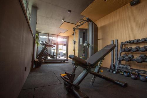 a gym with two exercise bikes in a room at Hotel Rosveld in Nederweert
