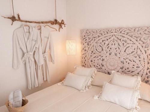 En eller flere senge i et værelse på AMARE Luxury Apartment