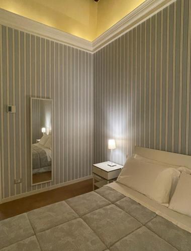 Una cama o camas en una habitación de b&b Arco Pinto