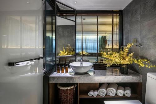 a bathroom with a sink and a large window at True Go S Hotel - Shenzhen Convention and Exhibition Center Union Square Branch in Shenzhen