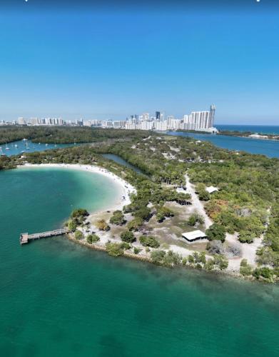 an island in the ocean with a city in the background at The Boutique Guest House in Miami