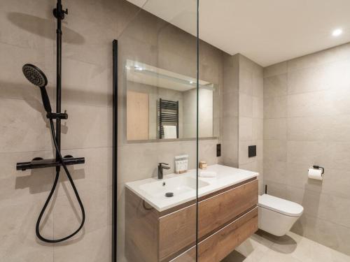 a bathroom with a shower and a sink and a toilet at Appartement familial, moderne et équipé, à proximité des pistes – Courchevel Le Praz - FR-1-568-39 in Courchevel
