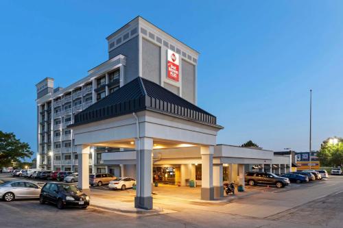 a gas station with cars parked in a parking lot at Best Western Plus Midwest Inn in Omaha