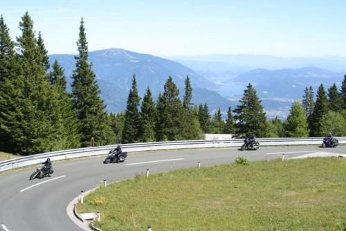 a group of people riding motorcycles down a road at Ferienwohnung Reichmann in Bodensdorf