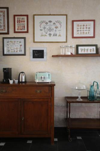 a room with a wooden cabinet and a table at Dimora Caffaro in Genoa