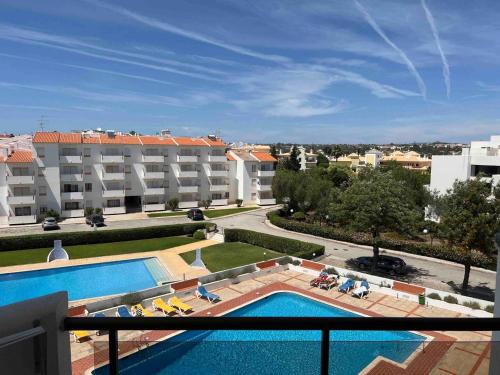 a view from a balcony of a hotel with a swimming pool at Coral By Albufeira Rental in Albufeira