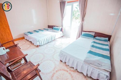 Postelja oz. postelje v sobi nastanitve Hoàng Long Hotel Tam Đảo