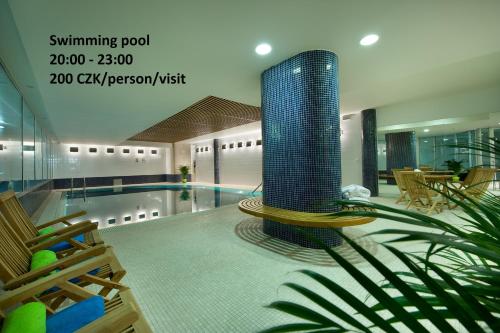 a room with a pool with a swimming pool at EA Hotel Julis in Prague