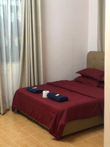 Letto o letti in una camera di Dtahan Motel Taman Negara