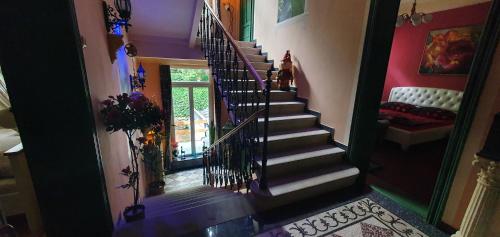 a hallway with a spiral staircase in a house at Edinburgh in Mariánské Lázně