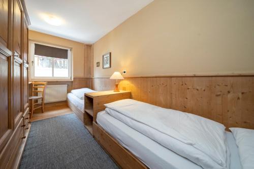 Кровать или кровати в номере Ciasa Buro - Thaus