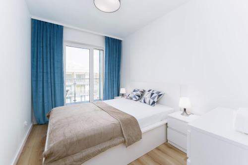 Postel nebo postele na pokoji v ubytování Apartament Morski Navigator by HolidaySun