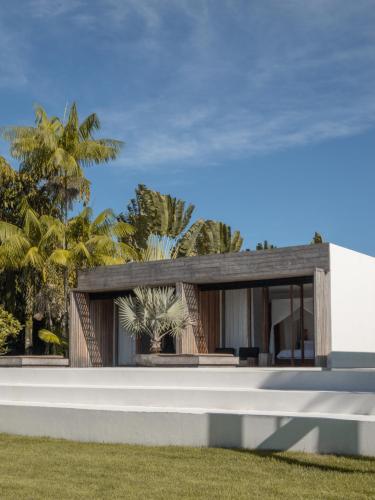 a rendering of a modern house with trees in the background at KA BRU Beach Boutique Hotel in Barra Grande