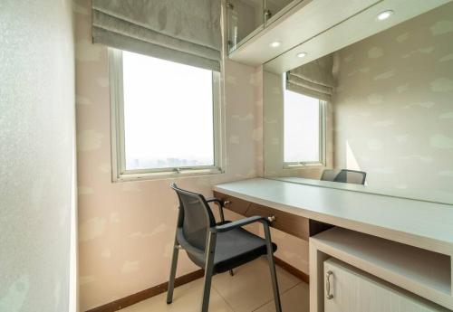 a home office with a desk and a chair at Exclusive and Cozy studio in central Jakarta in Jakarta