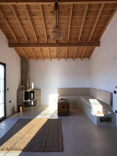 a large living room with a couch and a table at Arunurla Zeytinler Houses in Urla
