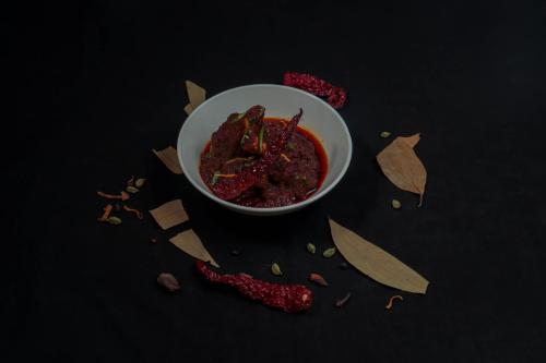 a bowl of food on a table with some food at Four Points by Sheraton Vadodara in Vadodara