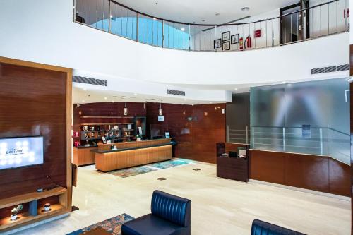 a lobby of a hotel with a waiting area at Four Points by Sheraton Vadodara in Vadodara