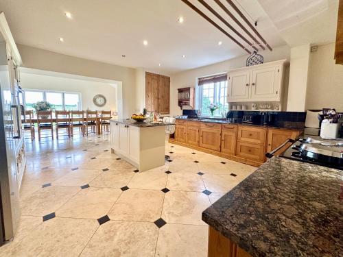a large kitchen with a island in the middle at Country Retreat in York