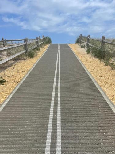 an empty road in the middle of the desert at The White Sands Resort and Spa in Point Pleasant Beach
