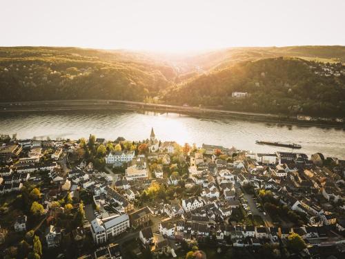 an aerial view of a town next to a river at Gästehaus Korf in Unkel