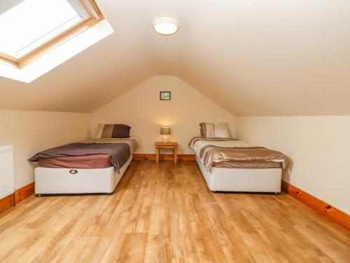Postel nebo postele na pokoji v ubytování Clogher Cottage