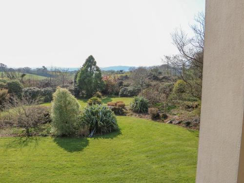 a view of a garden from a house at Bluebell House and Gardens in Rossbrin