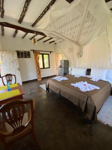 a bedroom with a large bed in a tent at Hotel Villa Malindi in Malindi