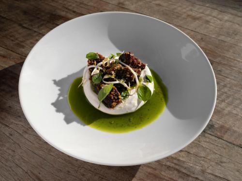 a white plate with a dessert on a table at KA BRU Beach Boutique Hotel in Barra Grande