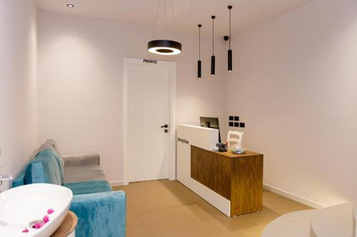 a living room with a sink and a refrigerator at Hotel Saly in Durrës