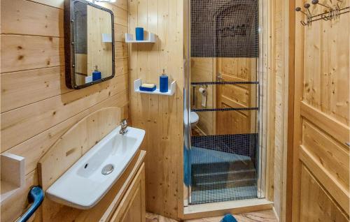 a bathroom with a sink and a shower at Stunning stacaravan In Pouilly-sous-charlieu With Kitchen in Pouilly-sous-Charlieu