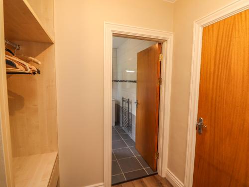 a hallway with a door leading to a walk in closet at Gap of Dunloe in Derrylea
