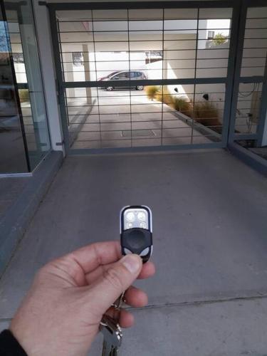 a person holding a cell phone in their hand at Simonetta in Puerto Madryn