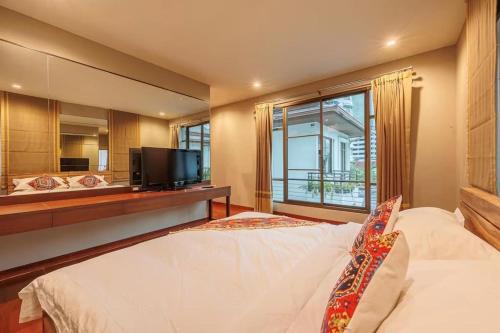 Postel nebo postele na pokoji v ubytování 曼谷摩洛哥风格之绝色之城