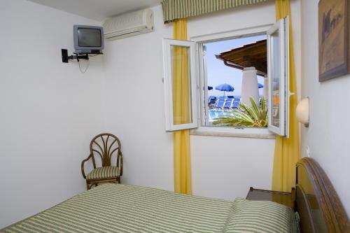 Ένα ή περισσότερα κρεβάτια σε δωμάτιο στο Casthotels Tramonto d'oro Terme