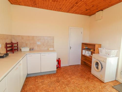 a kitchen with a washer and a washing machine at Mullagh Road in Miltown Malbay