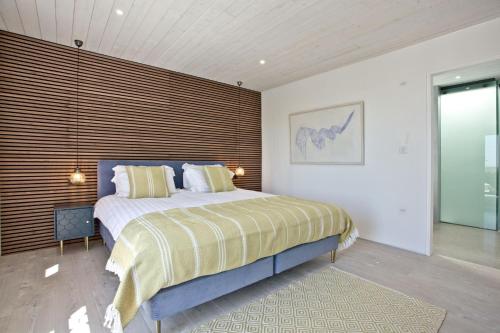 a bedroom with a bed and a large window at Rockpools in Newquay Bay Resort