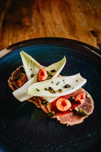 a blue plate with a piece of food on it at Coorie Inn Restaurant and Rooms in Crieff